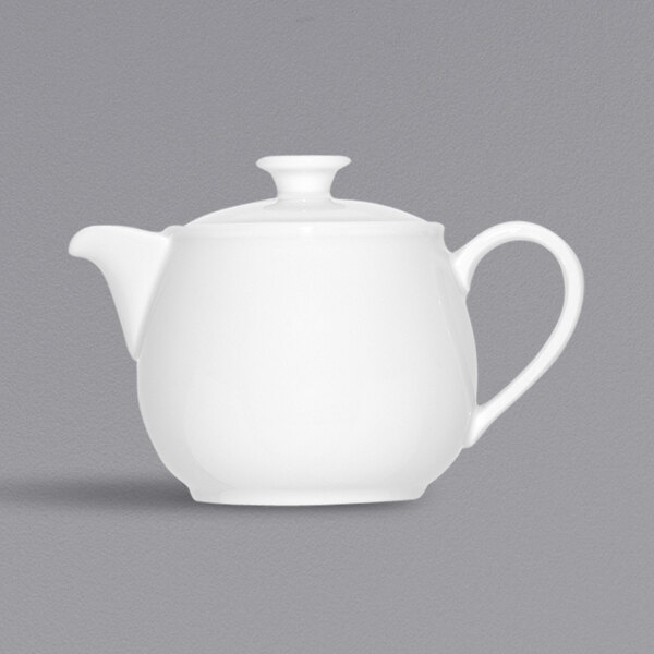 A Bauscher bright white porcelain teapot with a white handle and lid.