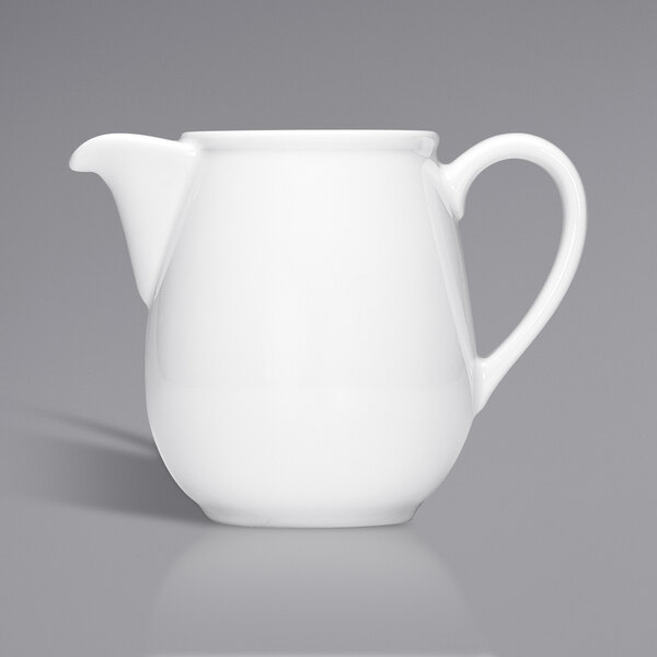 A Bauscher bright white porcelain coffee pot with a handle.