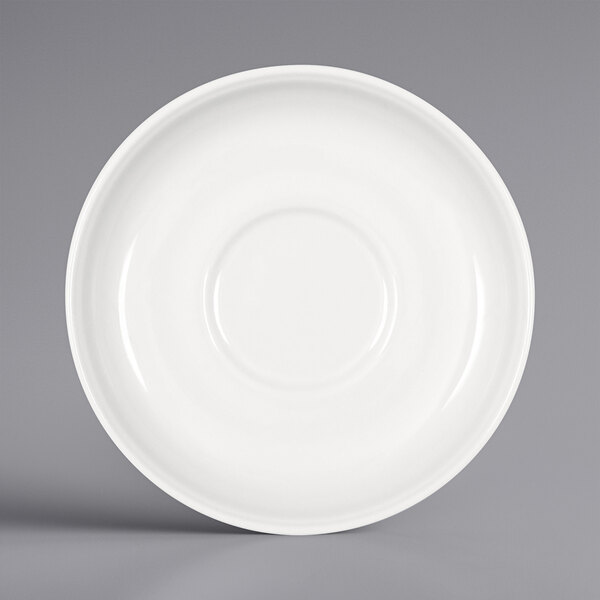 A Bauscher bright white porcelain saucer with a circular design.