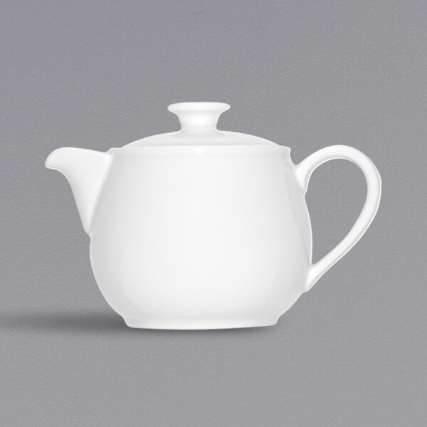 A Bauscher bright white porcelain teapot with a lid and handle.