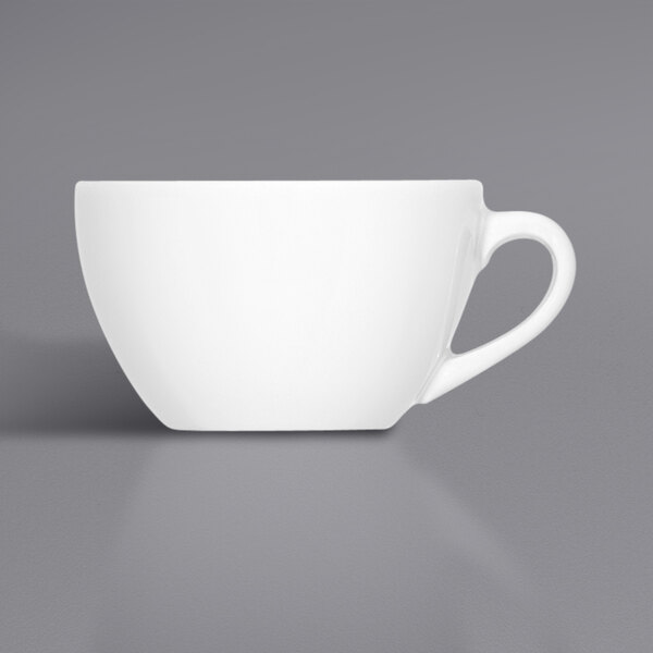 A close-up of a Bauscher bright white porcelain cup with a white handle.