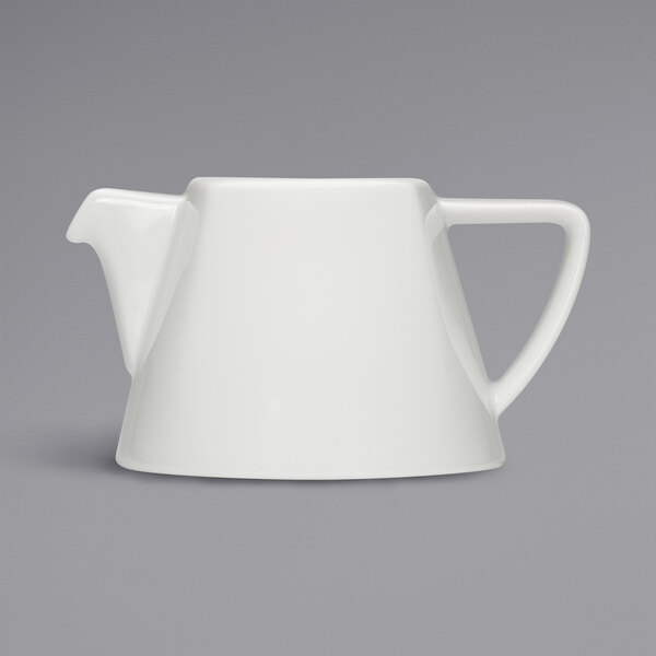 A close up of a Bauscher bright white porcelain teapot with a white handle.