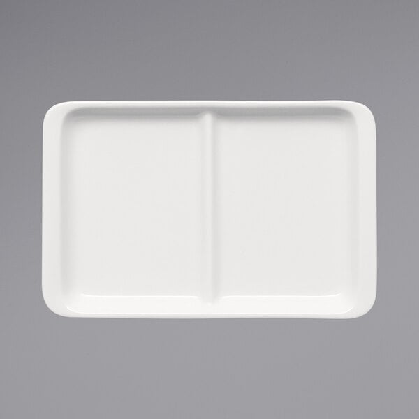 A Bauscher bright white rectangular porcelain platter with raised rim and two compartments.