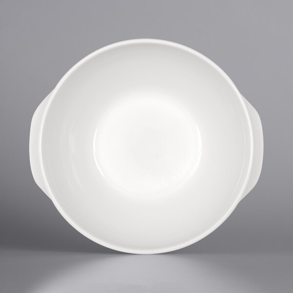 A Bauscher bright white porcelain stew bowl with handles.