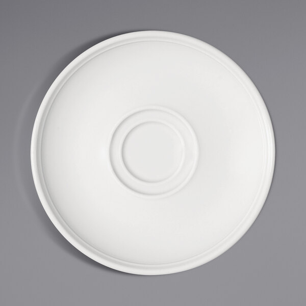 A Bauscher bright white porcelain saucer with a circular rim and circle in the middle.