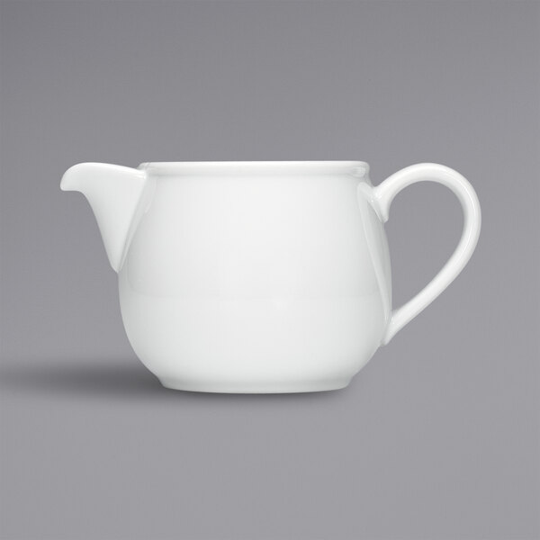 A white Bauscher porcelain teapot with a handle.