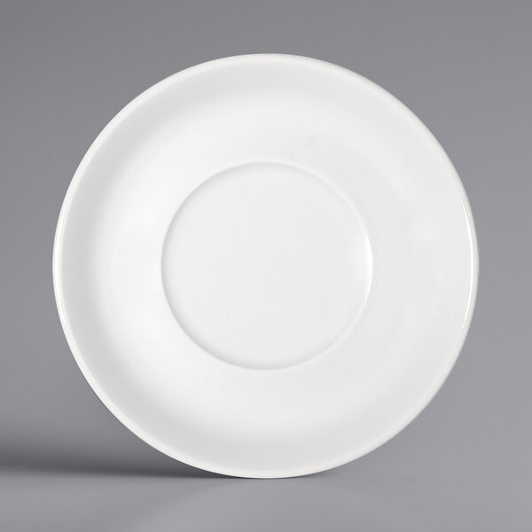 A close-up of a Bauscher bright white porcelain saucer with a round center.