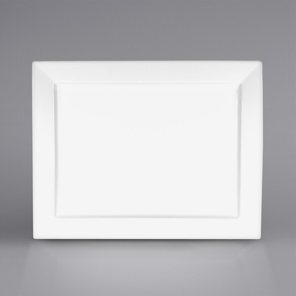 A bright white rectangular porcelain platter with a white border.