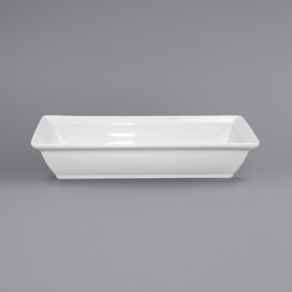 A white rectangular dish on a gray background.