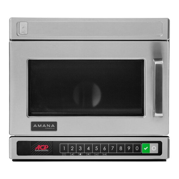 A stainless steel Amana commercial microwave with the door open.