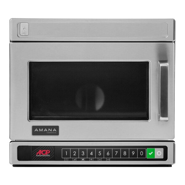 A stainless steel Amana commercial microwave with a black door.