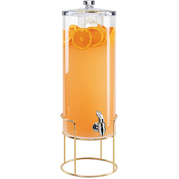 A Cal-Mil round beverage dispenser with an infusion chamber and orange juice with orange slices inside.