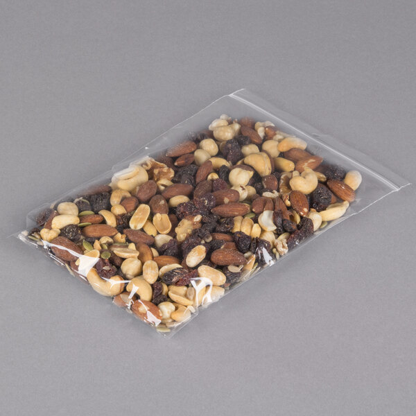 A LK Packaging plastic resealable food bag of nuts and raisins with a hang hole.