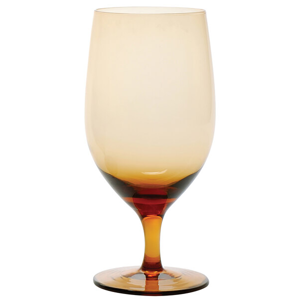 A close-up of a Fortessa Gala amber wine glass with a brown rim.