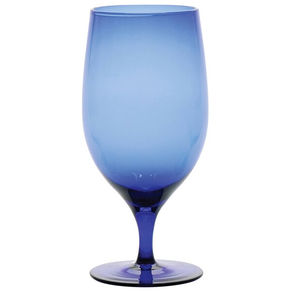 A close-up of a Fortessa cobalt blue wine glass with a rim.