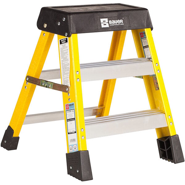 A yellow and black Bauer Corporation 350 Series fiberglass ladder.