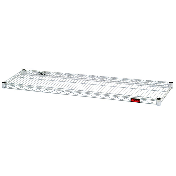 A stainless steel Eagle Group wire shelf with a red label.