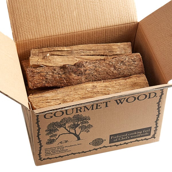 A box of Oak Wood Logs on a table.