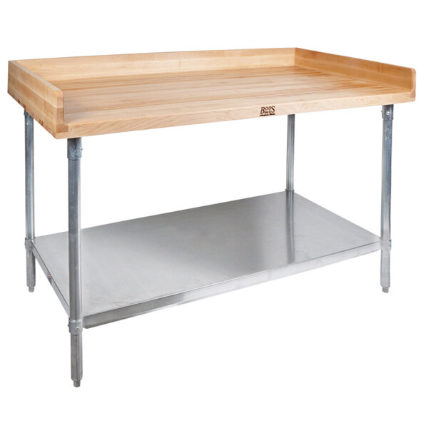 A John Boos wood top work table with a stainless steel base and shelf.