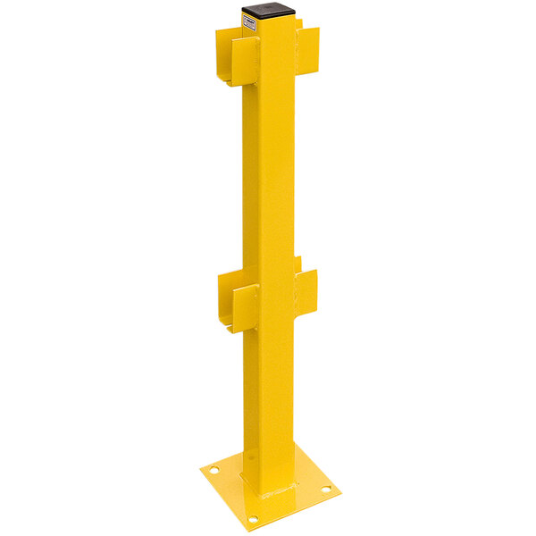 A yellow metal Bluff Manufacturing Crash Guard in-line post with black bases and double rails.
