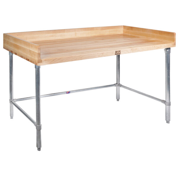 A John Boos wood top work table with metal legs and a shelf.
