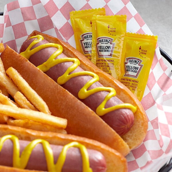 A hot dog with Heinz yellow mustard on it.
