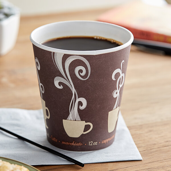 A Dart ThermoGuard paper hot cup filled with coffee on a napkin.
