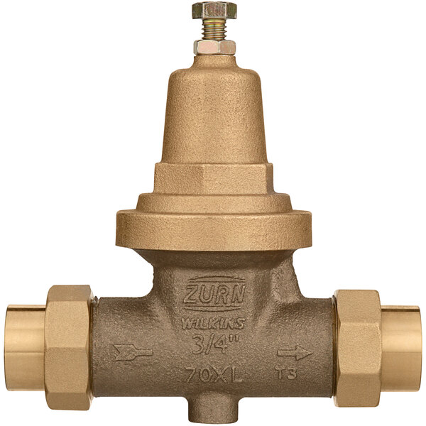 A close-up of a Zurn brass water pressure reducing valve and strainer.