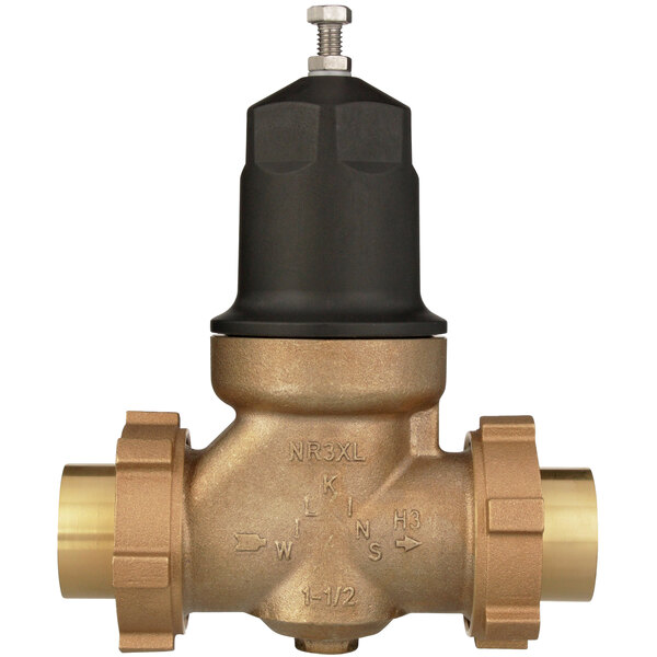 A Zurn water pressure reducing valve with a brass body and black handle.