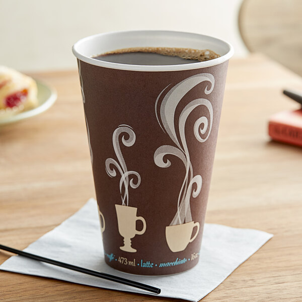 A brown Dart ThermoGuard paper hot cup with white designs on it filled with coffee on a table.