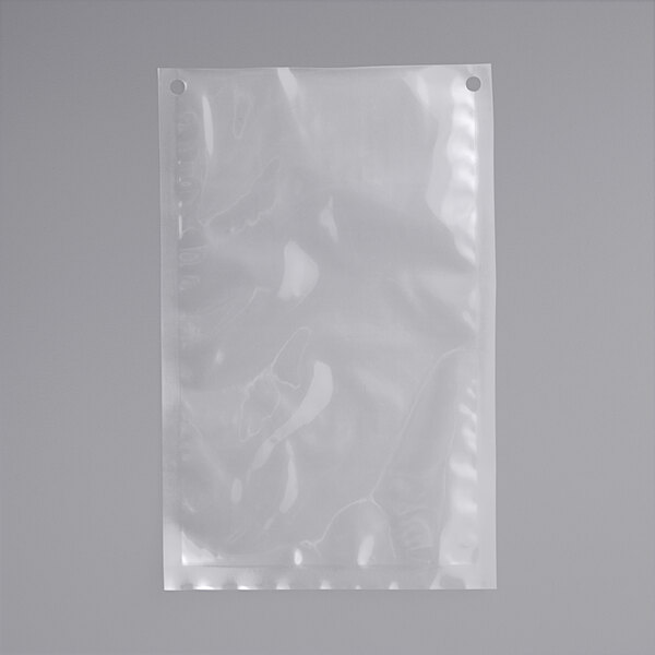 A clear plastic VacPak-It chamber vacuum packaging bag with holes.