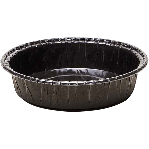 A black paper baking mold with a silver rim.