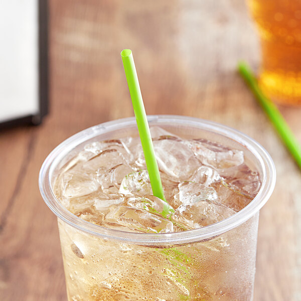 A clear cup of iced tea with a green EcoChoice PLA straw.