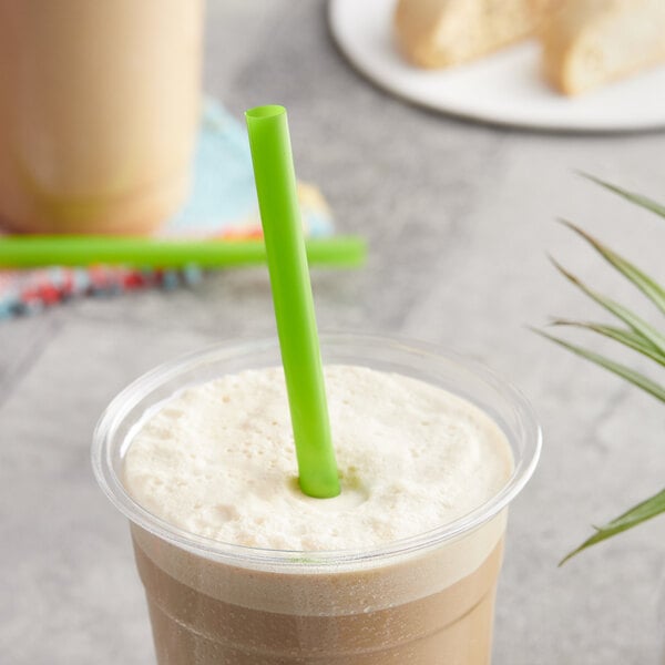 A cup of iced coffee with a green EcoChoice PLA straw in it.