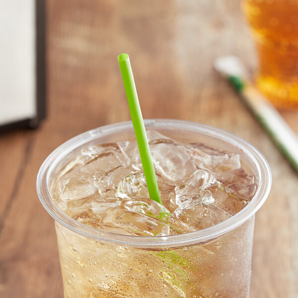 A clear plastic cup of ice tea with a green EcoChoice PLA straw.