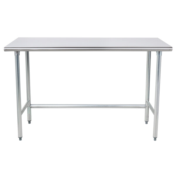 A stainless steel Advance Tabco work table with an open metal base.