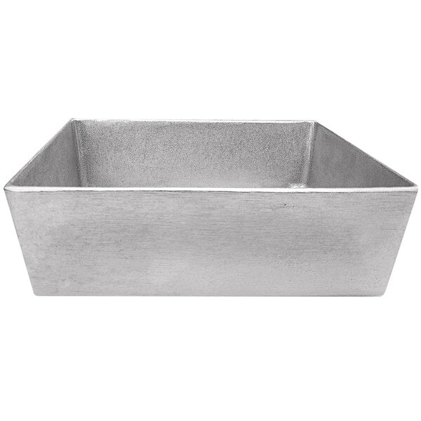 A Tablecraft natural finish rectangular metal bowl with straight sides on a counter in a salad bar.