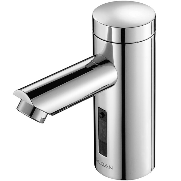 A close-up of a Sloan chrome hands-free faucet with a button.