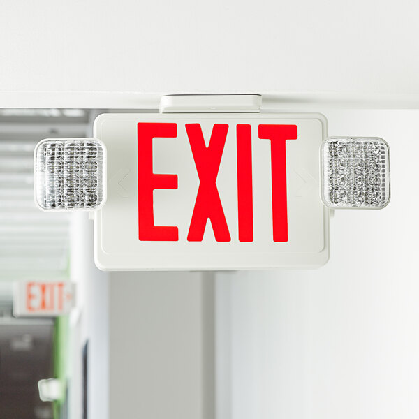 A red Lavex exit sign hanging from a ceiling.
