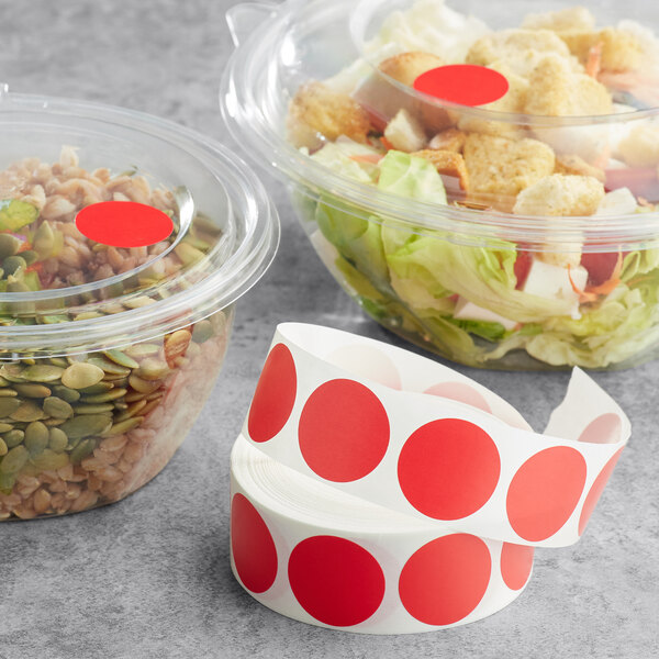 A salad in plastic containers with red Point Plus labels.