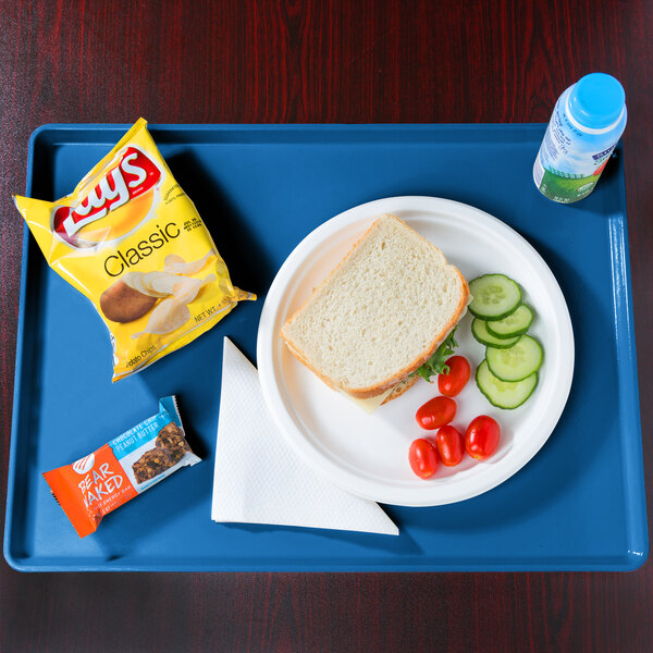 A Cambro dietary tray with a sandwich, vegetables, and a drink.