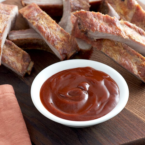 A plate of ribs with Heinz hickory smoked BBQ sauce.