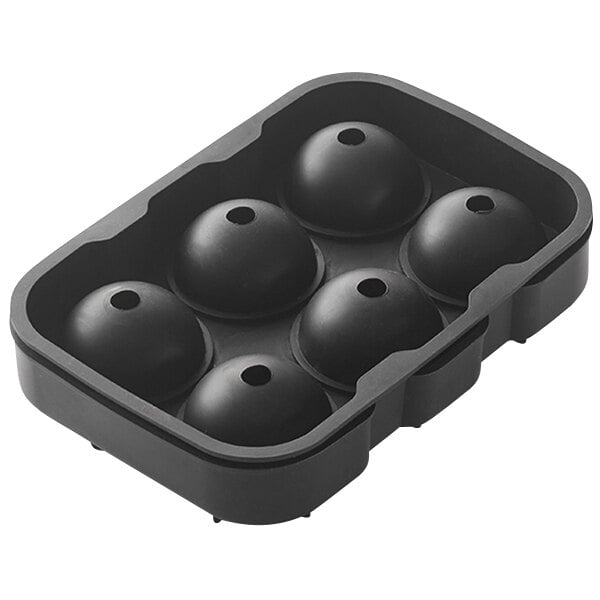 A black ice mold with six round spheres in it.