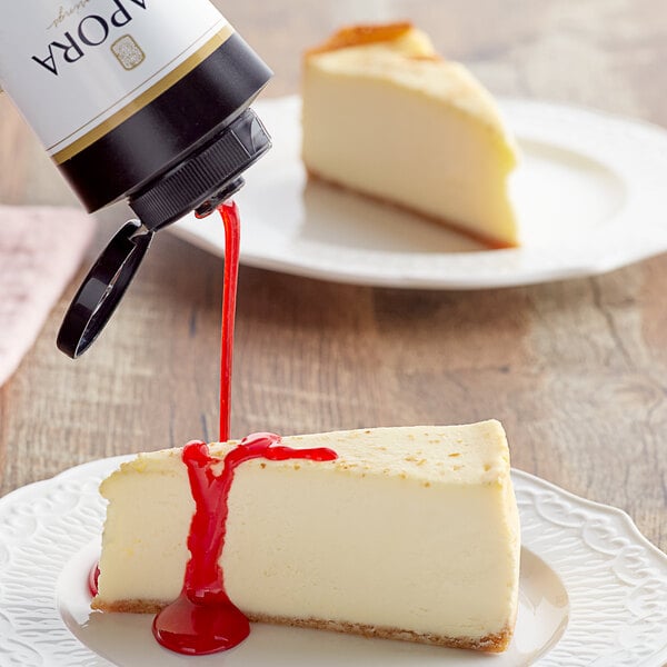 A piece of cheesecake with Capora Strawberry Flavoring Sauce.