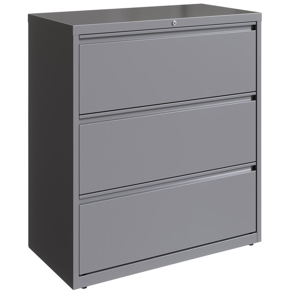 A Hirsh Industries arctic silver steel three-drawer lateral file cabinet.