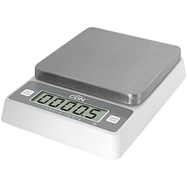 A CDN digital portion scale on a counter.