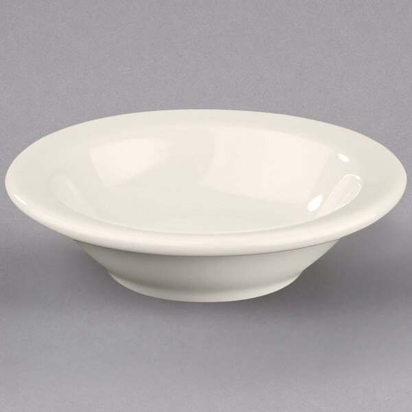 A Homer Laughlin ivory china bowl with a rolled edge.