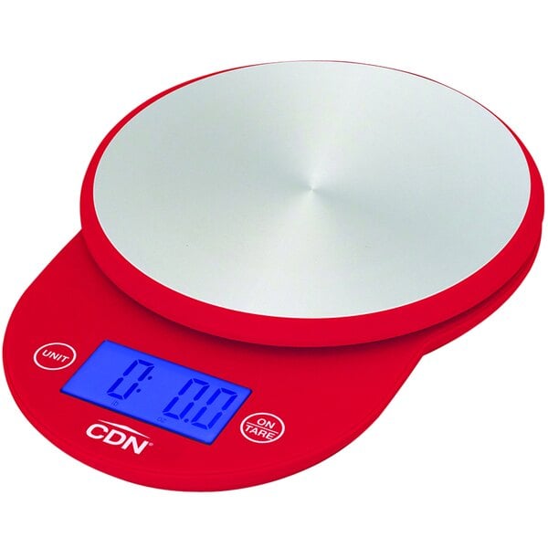 A red CDN digital round kitchen scale on a counter.