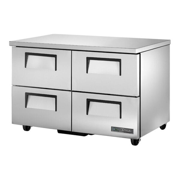 A silver True undercounter refrigerator with four drawers.