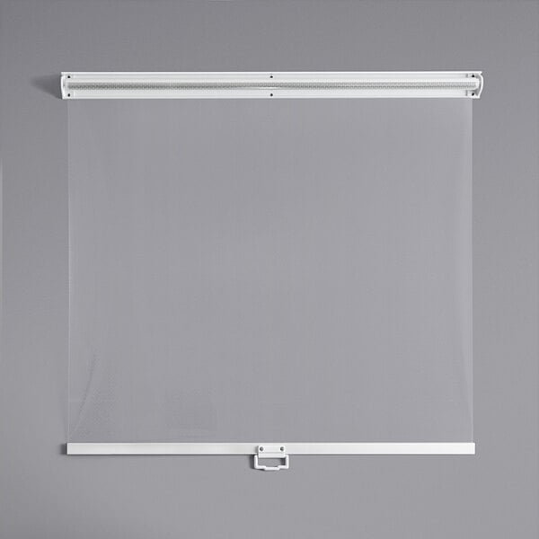 A white screen with a metal frame on a gray wall.